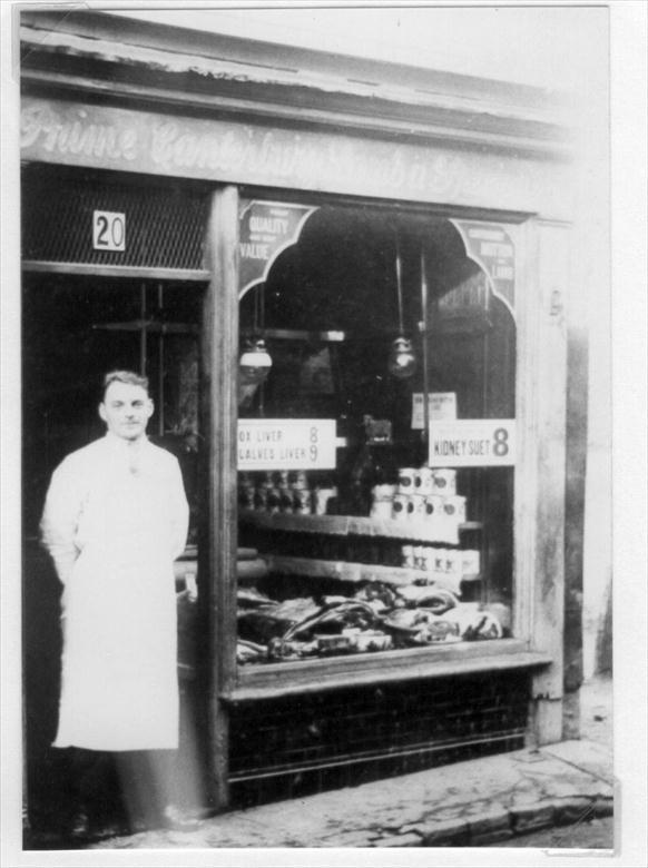 Photograph. Claude Leatherdale outside the London Central Meat Company shop at 20 Kings Arms Street, North Walsham.... later moved to 10 Market Place (North Walsham Archive).