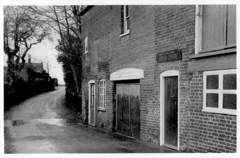 Photograph. Park Lane, from Kings Arms Street. The buildings have been replaced by terraced housing and the road widened towards the school and surgeries. (North Walsham Archive).