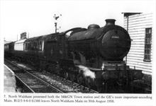 A B12/3 4-6-0 locomotive, No.61566, leaving North Walsham 