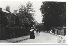 Grammar School Road showing two buskers with violin and harp