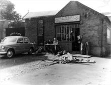 Jack Hewitt outside his Saddler's Shop on Church Plain North Walsham