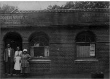 John (Joe) White before his Tea Rooms, with family, in Kings Arms Street, North Walsham.