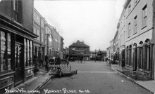 North Walsham Market Place, looking west. Note brick pathway to cross the muddy road.