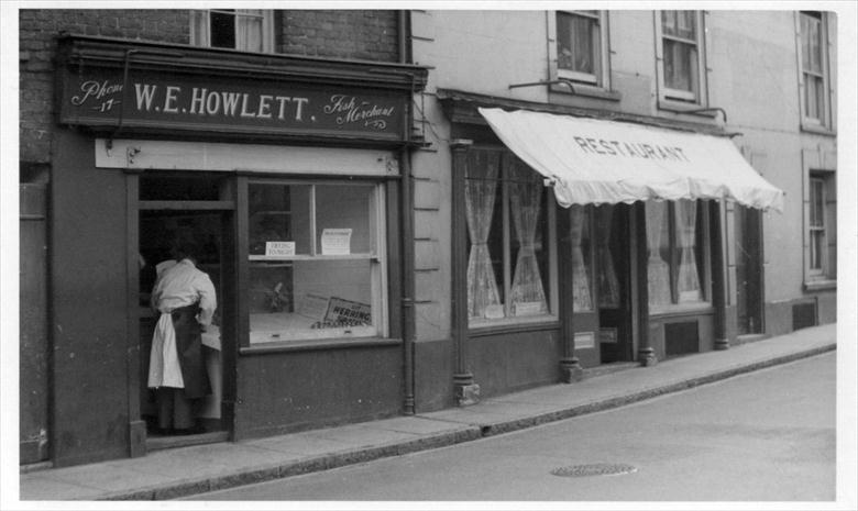 Photograph. Billy Howlett's fish shop on the north side of Market Street, North Walsham (North Walsham Archive).