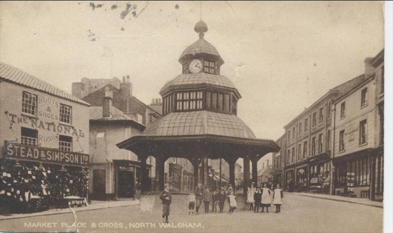 Chidren by Market Cross, North Walsham. (North Walsham Archive) Photograph. Chidren by Market Cross, North Walsham. (North Walsham Archive).