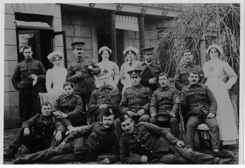 Convalescing soldiers and staff outside the Red Cross Voluntary Aid Detachment Hospital, Wellingtonia, 113 Mundesley Road, North Walsham during WW1 (North Walsham Archive) Photograph. Convalescing soldiers and staff outside the Red Cross Voluntary Aid Detachment Hospital, Wellingtonia, 113 Mundesley Road, North Walsham during WW1 (North Walsham Archive).
