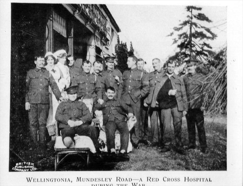 Photograph. Convalescing Soldiers and Staff at The Red Cross Voluntary Aid Detachment Hospital, Wellingtonia, 113 Mundesley Road, North Walsham (North Walsham Archive).