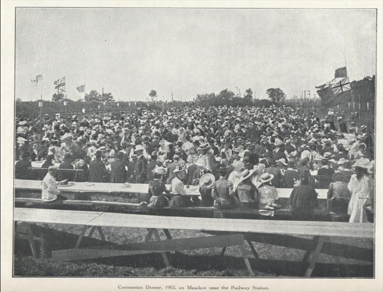 Photograph. Coronation Dinner 1902, the Railway Station Meadow. (North Walsham Archive).