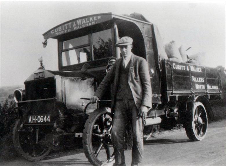 Cubitt & Walker's Napier Lorry, bodywork built by Frank Mann, Vicarage Street. Driver is John Martin Sandall (North Walsham Archive) Photograph. Cubitt & Walker's Napier Lorry, bodywork built by Frank Mann, Vicarage Street. Driver is John Martin Sandall (North Walsham Archive).