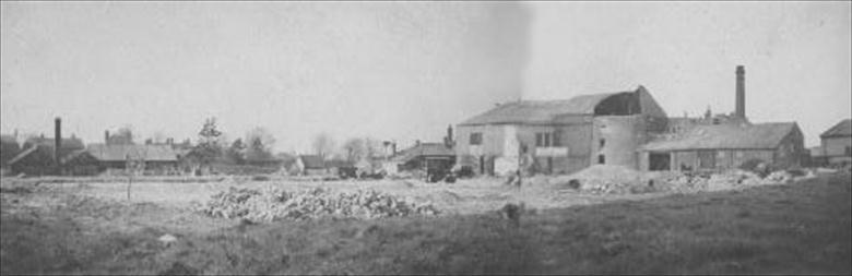 Photograph. Demolition of Cornish & Gaymer's works for new Canning Factory on Norwich Road. Centre right shows base of a tower mill. (photoRML) (North Walsham Archive).