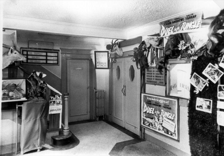 Photograph. Foyer of Regal Cinema, New Road, North Walsham prepared for "Duel in the Jungle". (North Walsham Archive).