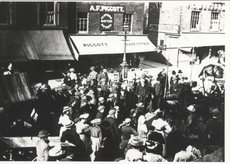 Photograph. In front of Church Loke, Market Day. (North Walsham Archive).