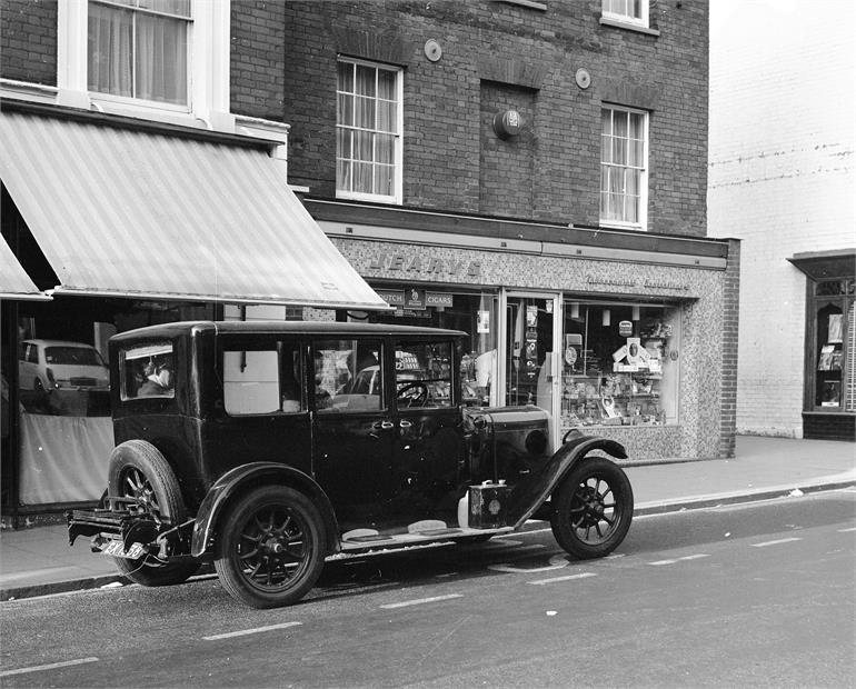 Photograph. 1927 Austin Windsor EX1938 outside Jearys (North Walsham Archive).