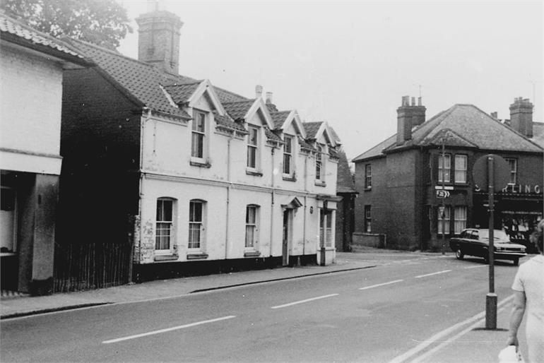 Photograph. Kings Arms Street, North Walsham in the late 1960s (North Walsham Archive).