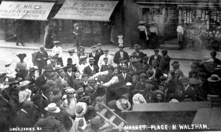 Photograph. Event in North Walsham Market Place (North Walsham Archive).