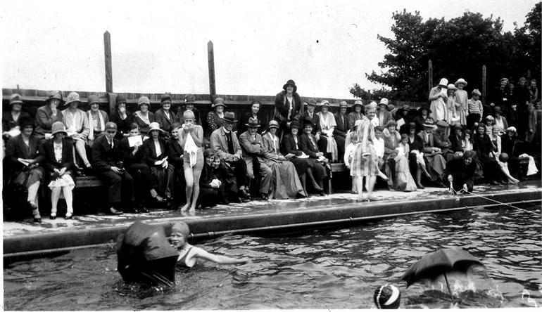 Photograph. North Walsham Girls' High school 1931 swimming sports at the Paston Grammar School's swimming pool (North Walsham Archive).