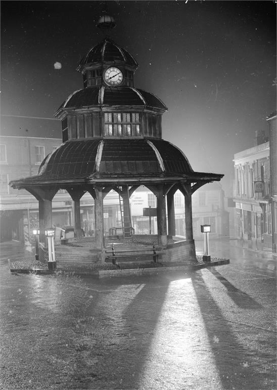 Photograph. North Walsham Market Cross on a rainy night (North Walsham Archive).