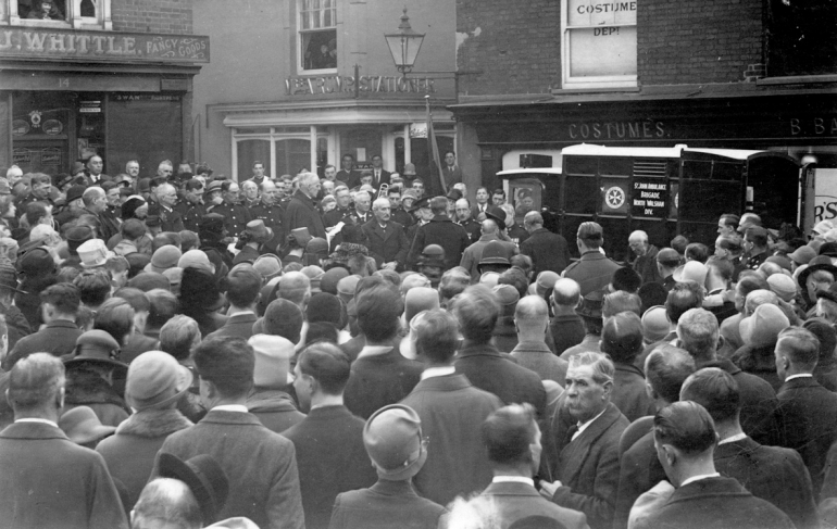 Photograph. North Walsham's first motor ambulance in Market Place (North Walsham Archive).