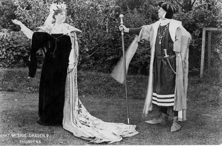 Photograph. "Philomena" in the Dell of "The Oaks" garden (now the dip beside the playground of the park). Right, Mr. Shepheard. Postcard made at "Ling's Shop". (North Walsham Archive).