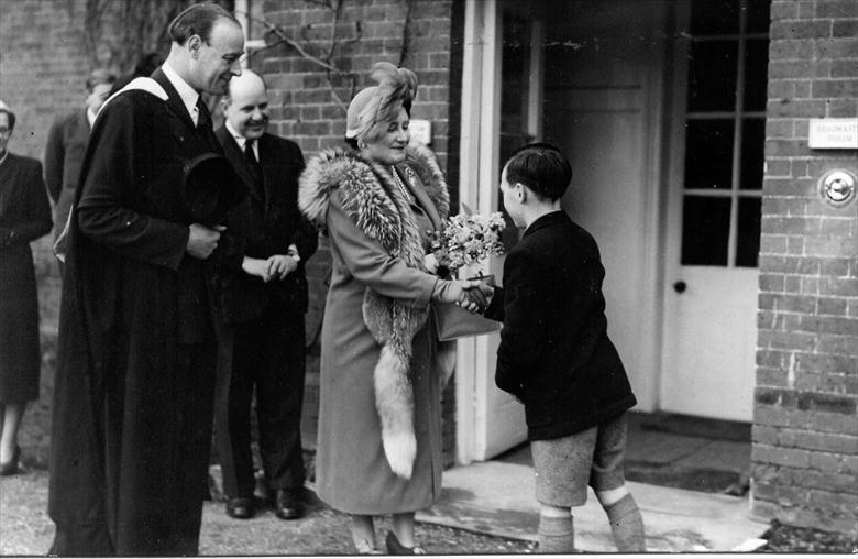 Photograph. Presentation of boquet to Queen Elizabeth on her visit to Paston Grammar School (North Walsham Archive).