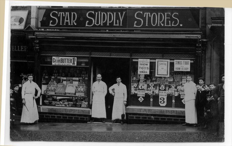 Photograph. Staff outside the Star Supply Stores, Market Street, North Walsham (North Walsham Archive).