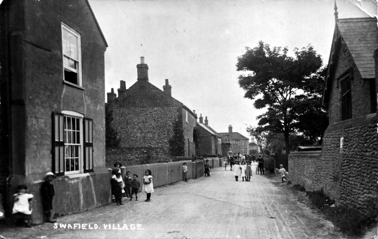 Photograph. Old postcard of Swafield Village high street in 1908. (North Walsham Archive).