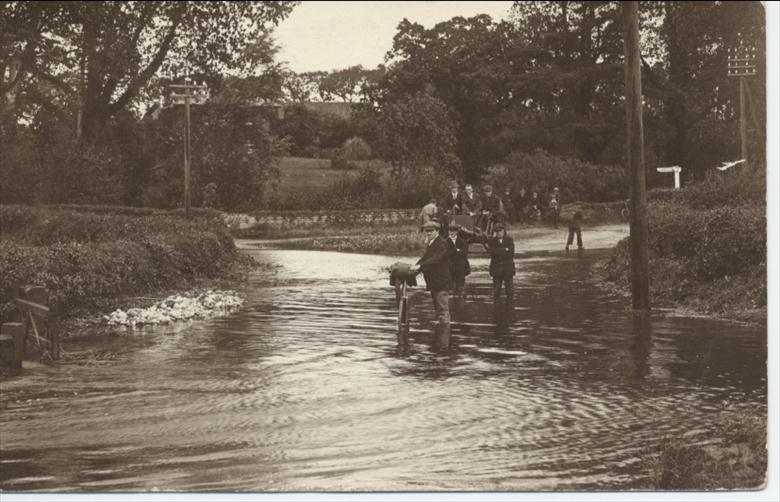 Photograph. View of 1912 flood at Royston Bridge, North Walsham (North Walsham Archive).