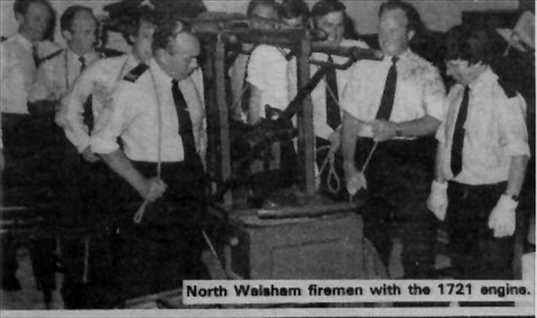 Photograph. Volunteer Firemen undertake the Restoration of North Walsham's 1721 Newsham Fire Engine. (North Walsham Archive).