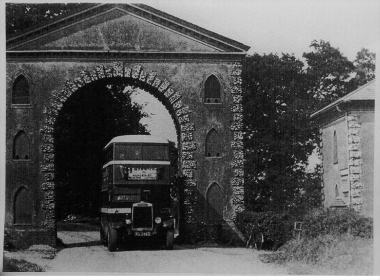 Westwick arch with Leyland TD1 motorbus (North Walsham Archive) Photograph. Westwick arch with Leyland TD1 motorbus (North Walsham Archive).