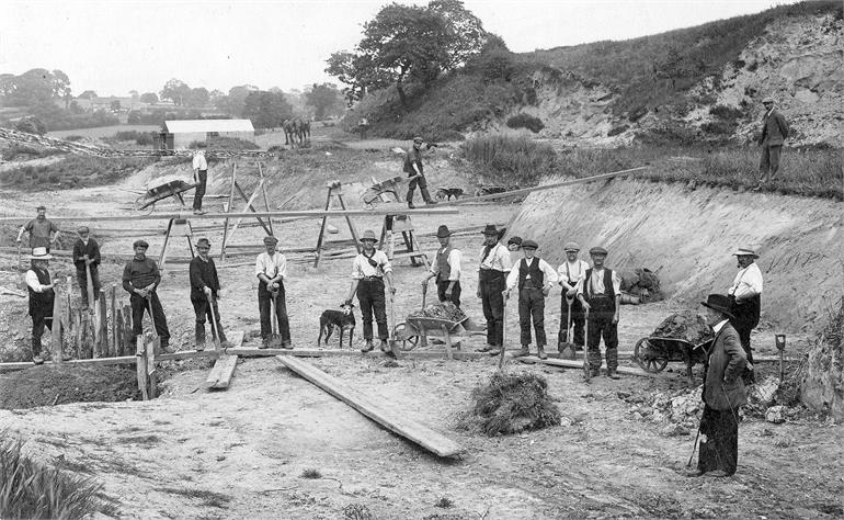 Photograph. Workers repairing North Walsham and Dilham Canal 1912 (North Walsham Archive).